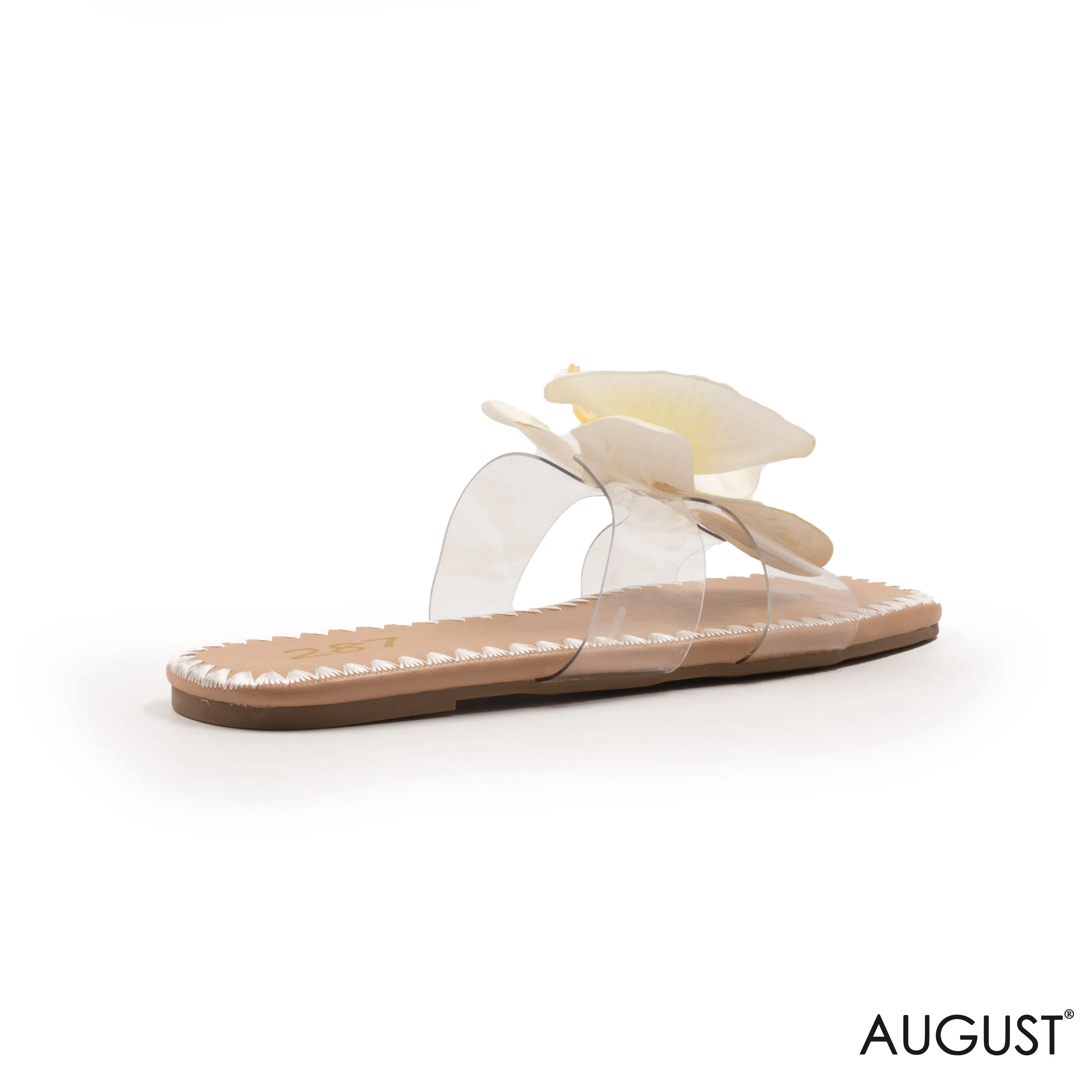 SLIPPER CLEAR WITH DETAILS WHITE COLOR FLOWERS FLAT SOLE.